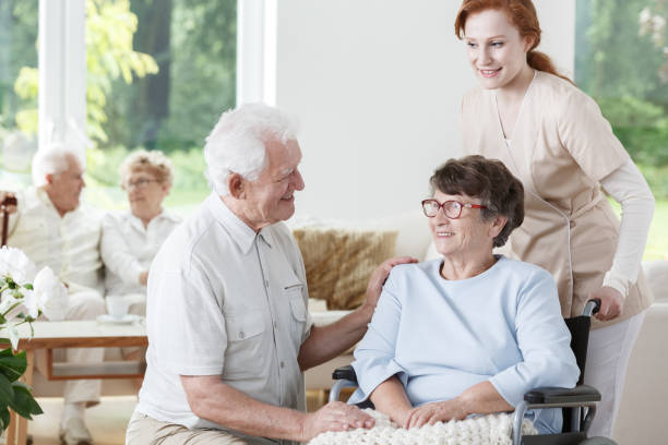istock Nurse supports disabled senior woman 834528846