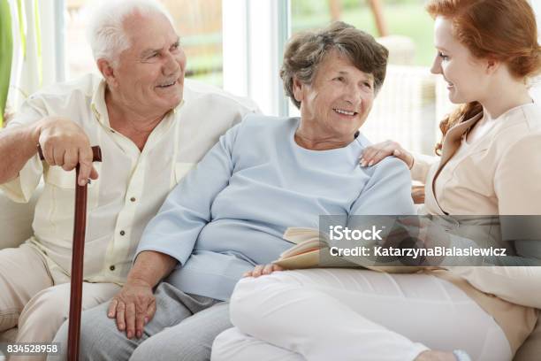 Two People Are Looking At Nurse Stock Photo - Download Image Now - Healthcare Worker, House, Senior Couple