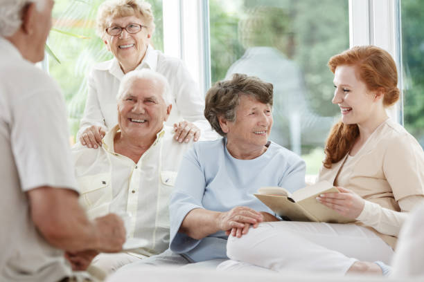 istock Smiling nurse holds book 834528960