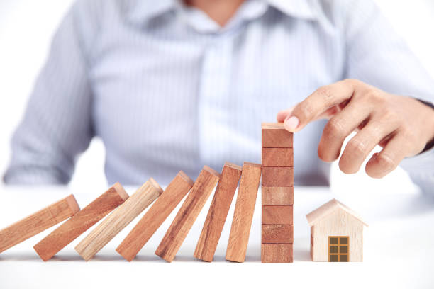 istock home insurance concept, wooden model home 834534328
