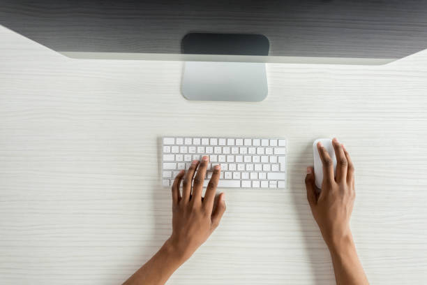 istock cropped shot of student typing on keyboard while working on computer 834541572