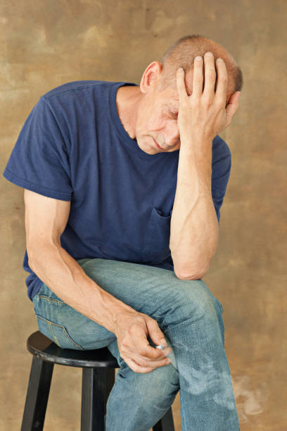 istock Worried mature man sitting at studio 834555554