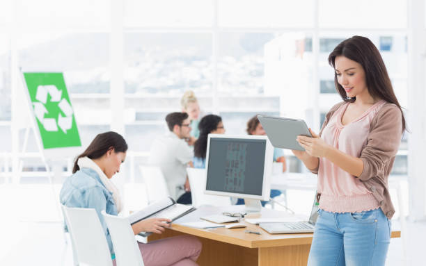 istock Artist using digital tablet with colleagues in at office 834570152