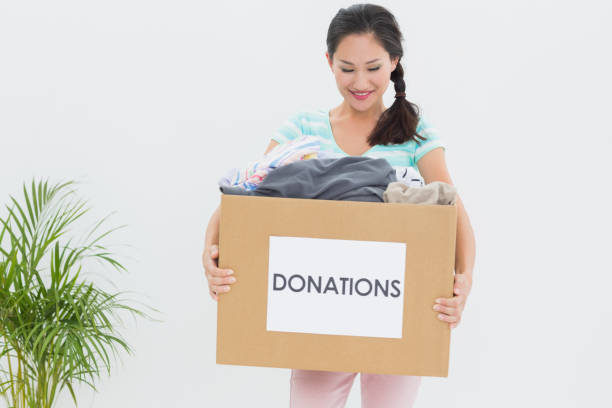 istock Woman with clothes donation 834573496