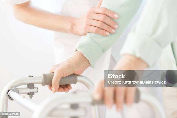 Assistant In White Uniform Stock Photo - Download Image Now - Home Caregiver, Nursing Assistant, Assistant