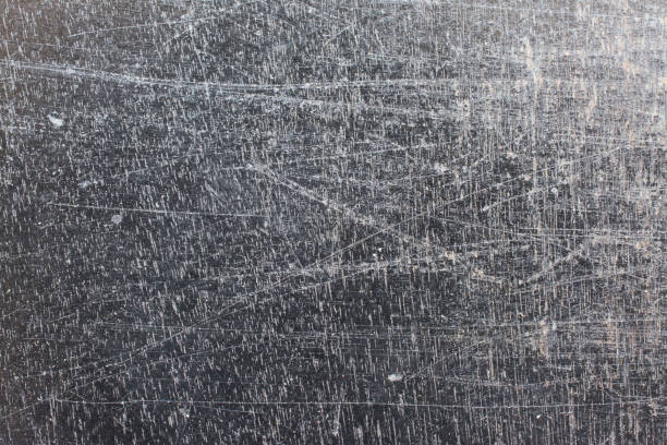 istock Grunge scratched texture, black varnish on wood background 834612980