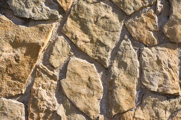 istock Pattern of chipped stones  wall texture and background 834616676