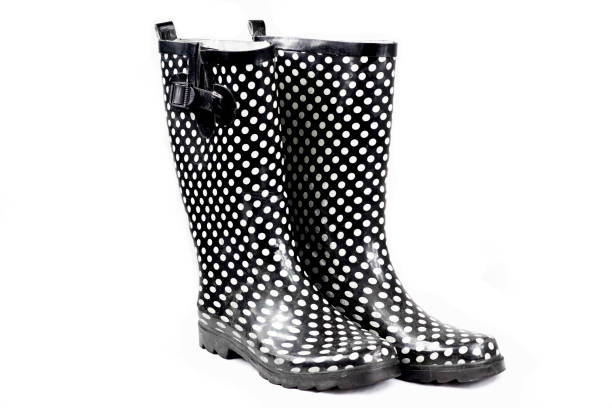 istock Womens black polka dot rain boots 834616686
