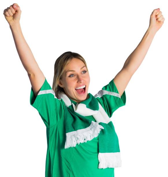 Cheering football fan in green jersey Cheering football fan in green jersey on white background football2014 stock pictures, royalty-free photos & images