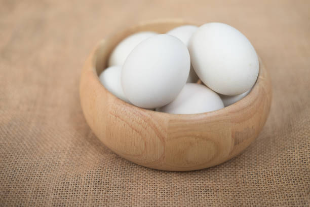 istock Many fresh duck eggs on wooden bowl 834638130