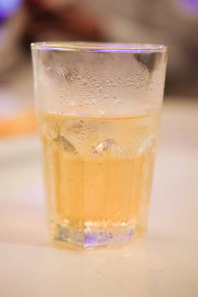 istock Beer in glass with warm light, close up 834639300