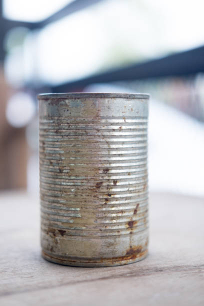 Old empty canned food on wood table