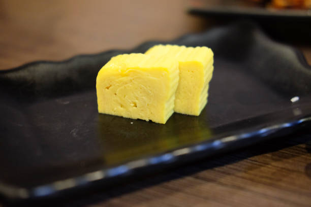 istock Sweet egg on black dish. Japanese food style 834639382