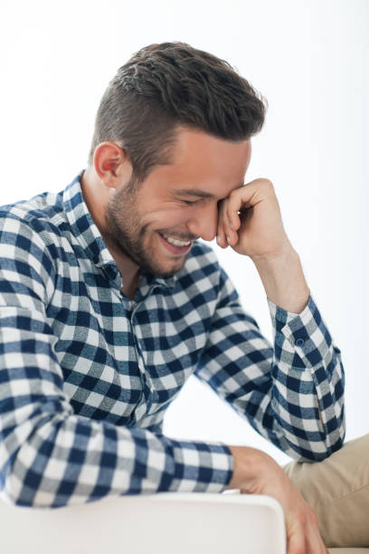 istock Side view portrait of smiling shy man 834639408