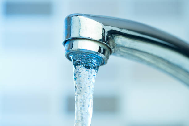 istock Pouring water from a Faucet 834646428