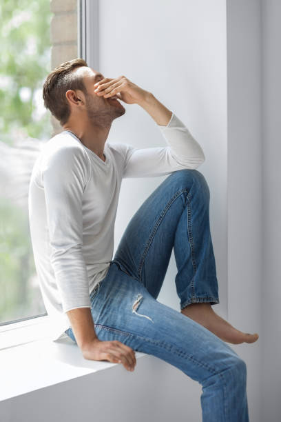 istock Handsome shy man close face with hand 834652948