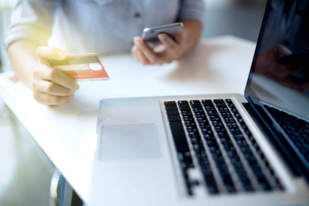 istock woman sitting use computer for pay the money 834665442