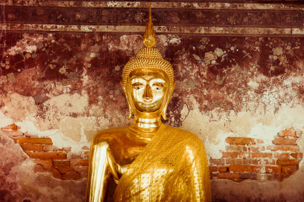 istock Golden buddha statue at public temple 834684540