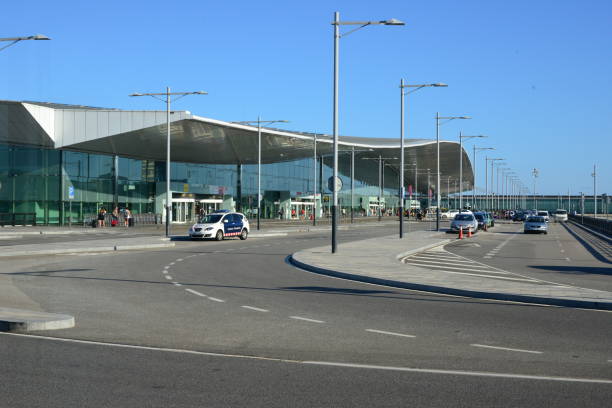 Barcelona, Catalonia, Spain, August 29th, 2015: passengers and police car at Barcelona–El Prat Airport  Terminal 1 building, land side - Mossos d'Esquadra police vehicle - photo by M.Torres