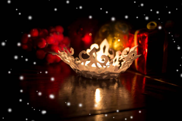 istock Christmas card.Candle,berries and  gift box.Background with snowflakes 834701454