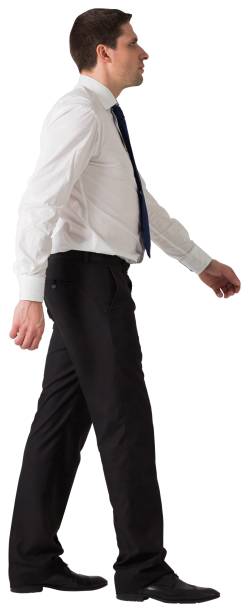 istock Handsome businessman in shirt and tie stepping 834705582