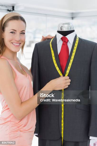 Female Fashion Designer Measuring Suit On Dummy Stock Photo - Download Image Now - 30-34 Years, 30-39 Years, Adult