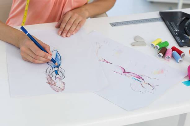 istock Mid section of a fashion designer working on her designs 834713840