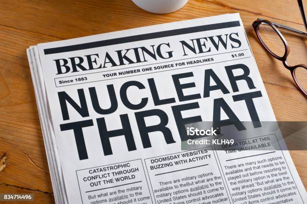 Nuclear Threat Headline On A Newspaper Stock Photo - Download Image Now - Air Pollution, Conflict, Danger