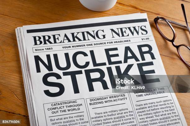 Nuclear Strike Headline On A Newspaper Stock Photo - Download Image Now - Air Pollution, Conflict, Danger