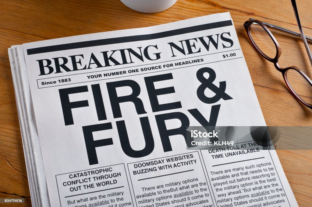 "Fie and Fury" Headline on a newspaper. Newspaper on a desk. Emotional Stress Stock Photo