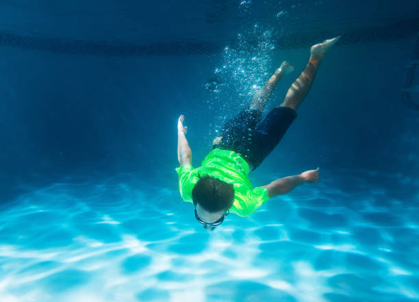 istock Teen swimming underwater 834716786