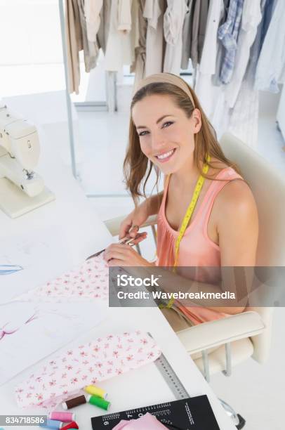 Young Female Fashion Designer Working On Fabrics Stock Photo - Download Image Now - 30-34 Years, 30-39 Years, Adult