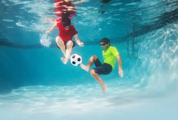 Photo of Kids playing underwater soccer