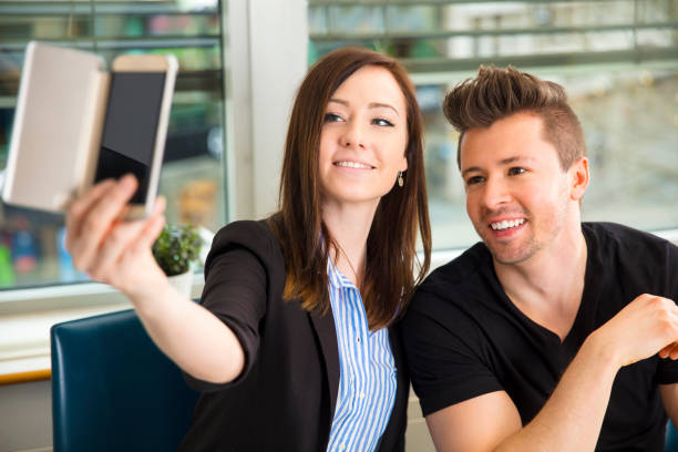 istock Business People Taking Selfie On Smart Phone 834758036