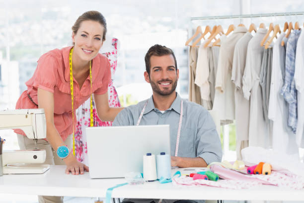 istock Fashion designers at work in bright studio 834759590