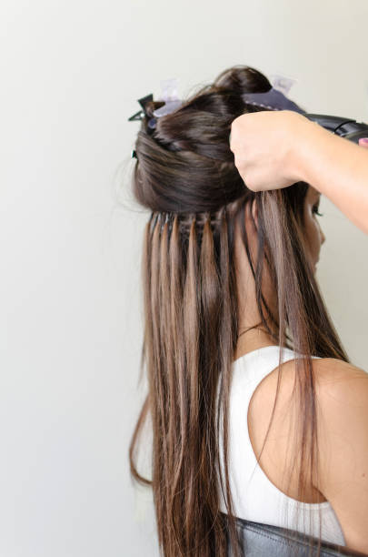 Step-by-Step Guide: Applying Pre Bonded Remy Hair Extensions at Home 1 side view of hair extension Portrait of a girl or womansitting on chair and make hair extension Prepare Your Hair and Extensions stock pictures, royalty-free photos & images