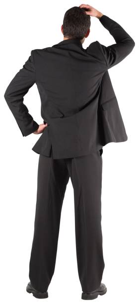 istock Businessman standing back to the camera with hand on head 834762996