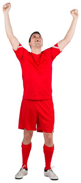 istock Excited young football player cheering 834764008