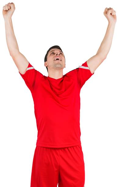 istock Excited young football player cheering 834764024
