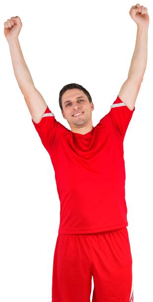 istock Excited young football player cheering 834764048