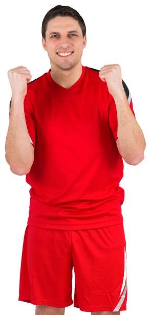 istock Excited young football player cheering 834764070