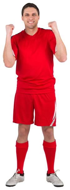 istock Excited young football player cheering 834764078