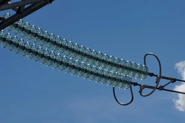 Photo of Garland of high-voltage glass insulators.