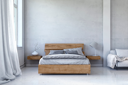 Bedroom with decoration on white hardwood floor in front of empty concrete wall with copy space. Slight vintage effect added. 3D rendered image.