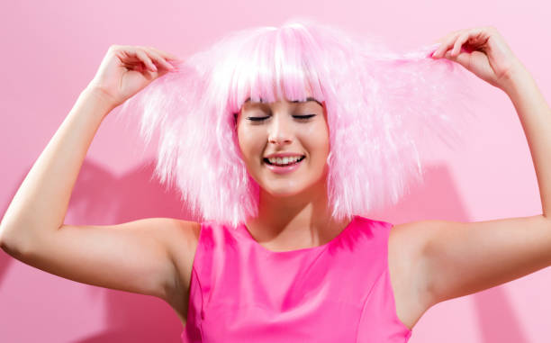 istock Beautiful woman in a bright pink wig 834773048