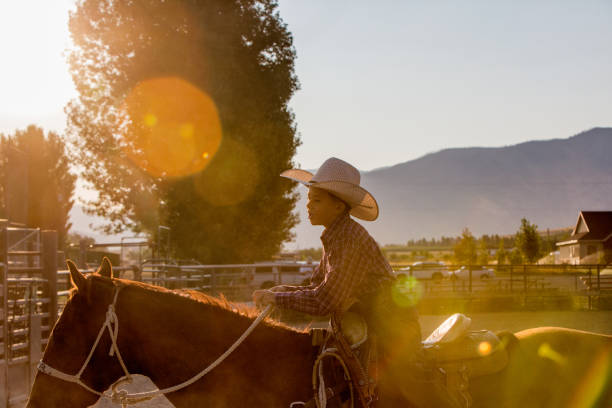 istock Cute Little Boy on Horseback in Rodeo Arena 834774774
