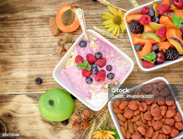 Vegetarian Meal Oatmeal With Fruit Yogurt Stock Photo - Download Image Now - Almond, Apple - Fruit, Apricot