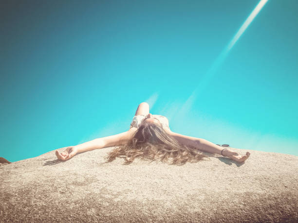 istock Girl chilling out on a big stone 834787442