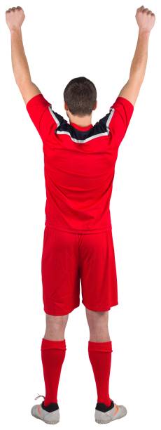 istock Excited young football player cheering 834788334