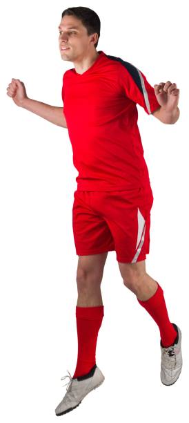 istock Fit football player jumping up 834788598